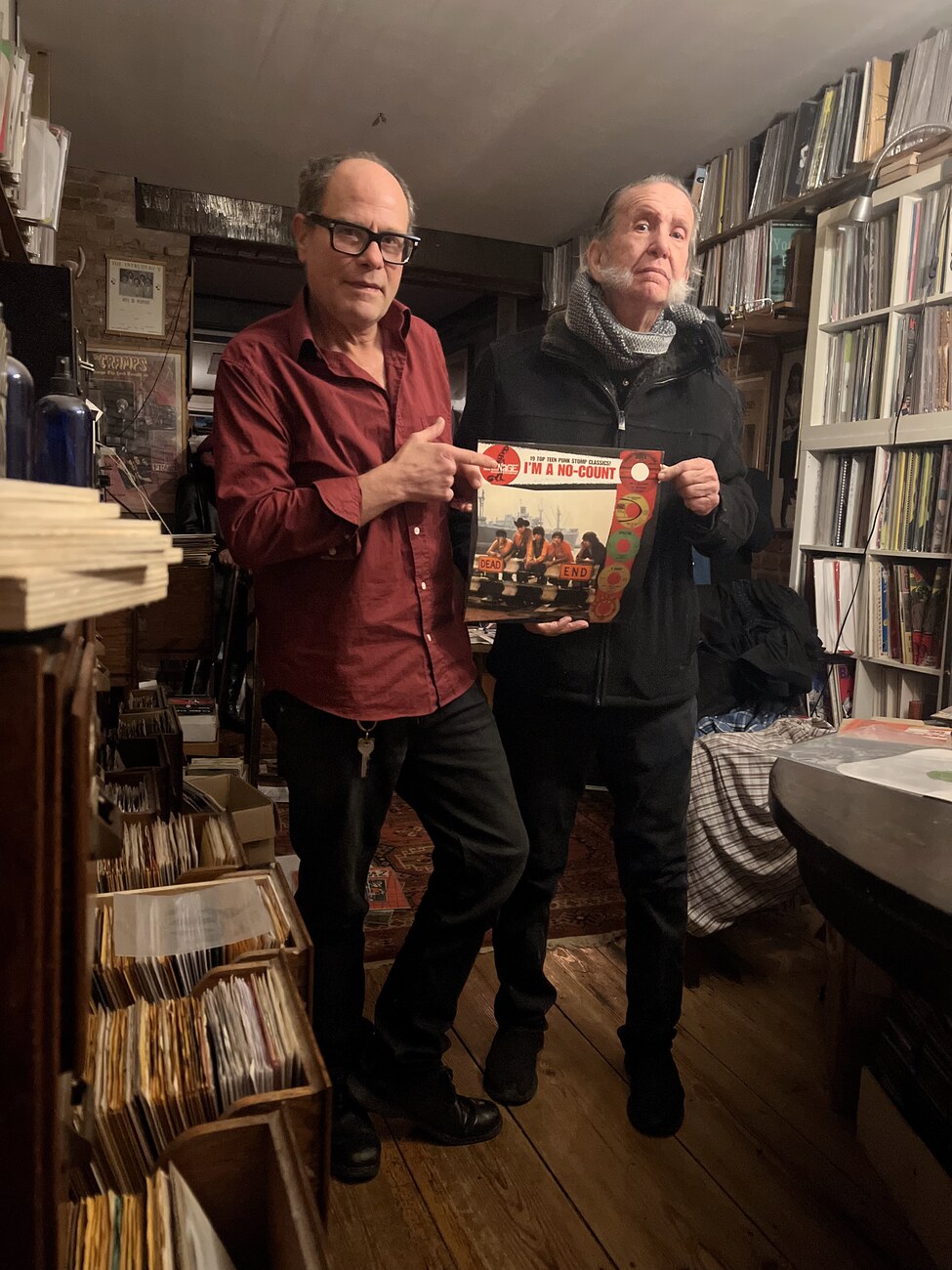 Ty Wagner holding the I'm a No Count LP at a record shop